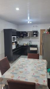 Kuchyň nebo kuchyňský kout v ubytování Casa Temporada Torres