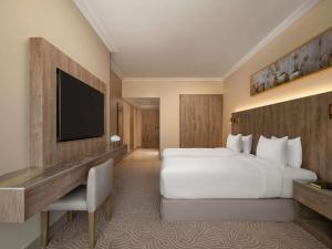 Postel nebo postele na pokoji v ubytování Movenpick Hotel & Residences Hajar Tower Makkah