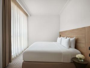 Postel nebo postele na pokoji v ubytování Movenpick Hotel & Residences Hajar Tower Makkah