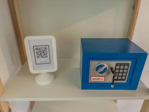 a toy calculator and a box on a shelf at Maison traditionnelle totalement privée au médina in Chefchaouene