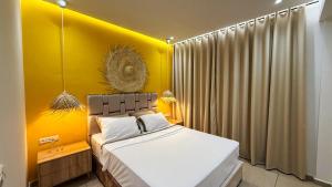 a bedroom with a yellow wall and a bed at Vue imprenable sur mer in Tangier +13 photos