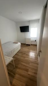 TV a/nebo společenská místnost v ubytování Ribera y Gastronomía