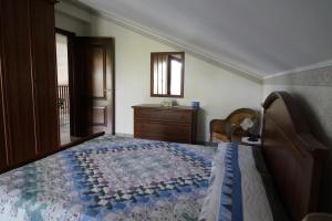 Posteľ alebo postele v izbe v ubytovaní Villa esclusiva con piscina privata e vista Etna