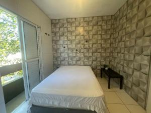 Кровать или кровати в номере Casa de Praia- Suíte Itaguaré