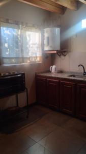 Kuchyň nebo kuchyňský kout v ubytování La alpina del bosque