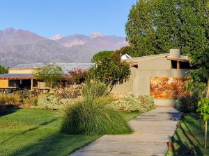 a house with a sign on the side of it at Dobe Lodge in Vista Flores