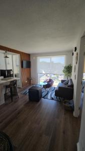 a living room with a couch and a table at Departamento 2 dormitorios vista al lago in Villarrica
