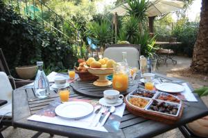 a table with food and a bowl of fruit and orange juice at Maison De L'Orb in Béziers +33 photos