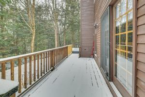a wooden walkway leading to a porch on a house at 8 Mi to Mt Snow Cozy Bear Cabin with Hot Tub! in Wilmington