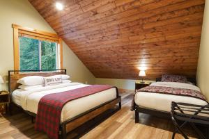 Ένα ή περισσότερα κρεβάτια σε δωμάτιο στο Cottonwood Cabin +66 φωτογραφίες