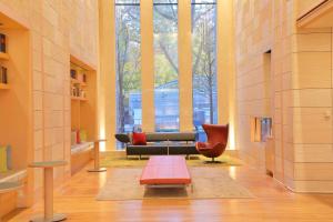 a lobby with a couch and chairs in a building at Hotel Resol Trinity Sapporo in Sapporo