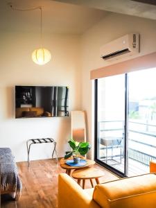 TV a/nebo společenská místnost v ubytování Casita Playa dream stay near Eagle Beach + 26 fotografií