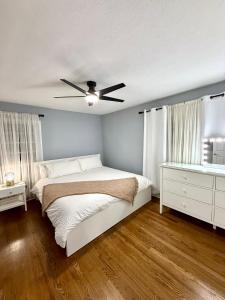 a bedroom with a bed and a ceiling fan at Cozy Mid Century Home in Athens GA in Athens