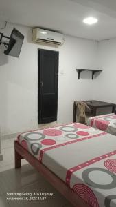 Una cama o camas en una habitación de Hotel El Rancho de Juancho