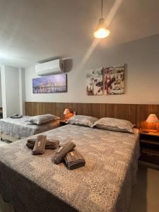 Ένα ή περισσότερα κρεβάτια σε δωμάτιο στο Studio 2 min do Hospital Unimed e Shopping Park Sul