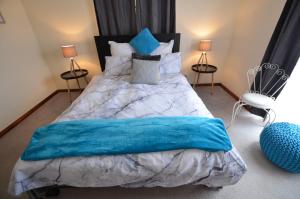 Postel nebo postele na pokoji v ubytování Ayres Rocks