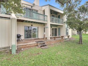 a house with a large porch with a deck at Adventure House RRYC17 in Rockport