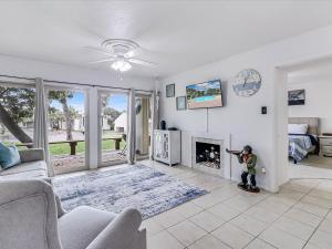 a child standing in a living room with a fireplace at Adventure House RRYC17 in Rockport