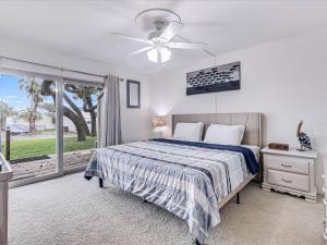 a bedroom with a bed and a ceiling fan at Adventure House RRYC17 in Rockport +38 photos