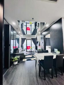 a large living room with a table and a couch at AC Homestay - Nera Garden Huế in Hue +18 photos