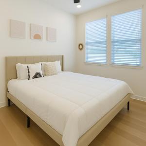 Ένα ή περισσότερα κρεβάτια σε δωμάτιο στο Worker friendly A plus Location Warm and Cozy