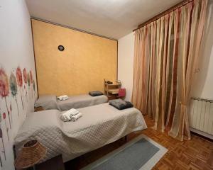 Ένα ή περισσότερα κρεβάτια σε δωμάτιο στο Paolo&SilviaHost +16 φωτογραφίες