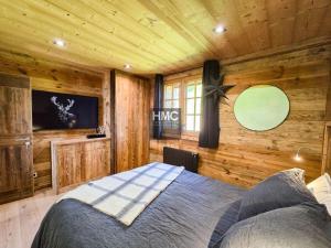 Ένα ή περισσότερα κρεβάτια σε δωμάτιο στο Chalet Moose Lodges SPA Sauna