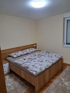 a bedroom with a bed in a room at Apartment Lara in Mostar +5 photos