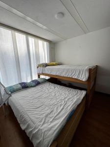 Voodi või voodid majutusasutuse Apartmento en Villa Toscana toas