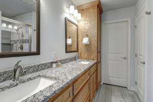 a bathroom with a large sink and a mirror at A Wave From It All in Rockport +40 photos