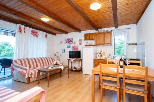 a living room with a couch and a table at Apartment Kampor 5014b in Kampor