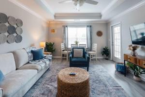 a living room with a couch and a table at Spacious 3 Bed Condo Near ETSU in Johnson City