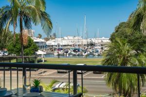 a view from a balcony of a marina with boats at Sailport Mooloolaba Apartments in Mooloolaba