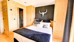 En eller flere senge i et værelse på Chalet 1ère Étoile une vue à couper le souffle