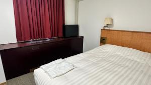 Ένα ή περισσότερα κρεβάτια σε δωμάτιο στο Pioland Hotel +12 φωτογραφίες