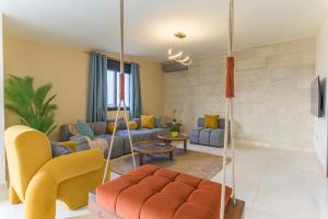 a living room with a swing in a room at Serenada 2BR Apartment In Batroun in Batroûn