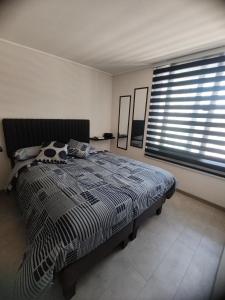 Ένα ή περισσότερα κρεβάτια σε δωμάτιο στο Suite urbana +15 φωτογραφίες