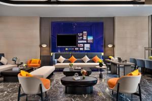 TV a/nebo společenská místnost v ubytování Hilton Garden Inn Changde Economic and Technological Development Zone