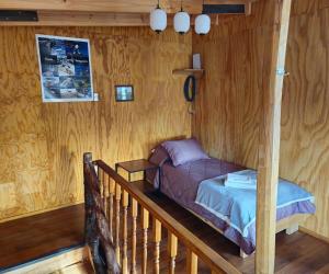 Ένα ή περισσότερα κρεβάτια σε δωμάτιο στο Casa Los Leones in Villa O'Higgins