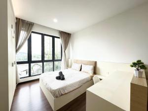 Ένα ή περισσότερα κρεβάτια σε δωμάτιο στο Silksky Service Apartment -1BR, 4pax - Free Parking, Netflix, High speed WIFI - Near The MINES, Serdang, IOI City Mall, UTAR, UPM, Cheras Selatan