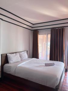 Postel nebo postele na pokoji v ubytování Kurniawan homestay 2 + 11 fotografií