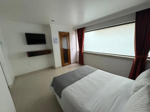 Postel nebo postele na pokoji v ubytování Lavid Hotel Palacio Real