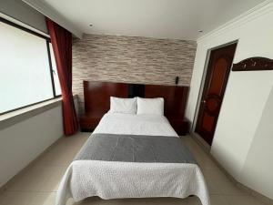 Postel nebo postele na pokoji v ubytování Lavid Hotel Palacio Real