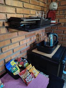 a table with some food on top of a brick wall at Habitación standard - SKYHOME I in Luque