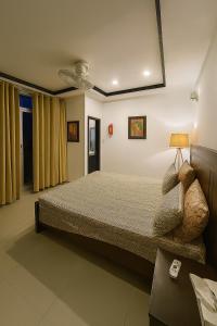 En eller flere senge i et værelse på Green Oasis