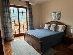 En eller flere senge i et værelse på Villa Rosina Veranda