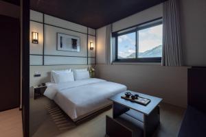 Postel nebo postele na pokoji v ubytování Mitsuya Ryokan Hotel Gongju Donghaksa Temple by Aank + 219 fotografií