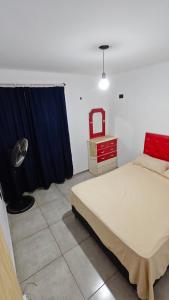 En eller flere senge i et værelse på Cabaña la Fride