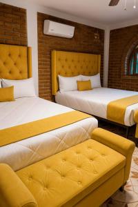 Ένα ή περισσότερα κρεβάτια σε δωμάτιο στο Hotel Flamora