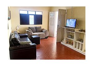 Et tv og/eller underholdning på Casa PÉ NA AREIA Paripueira